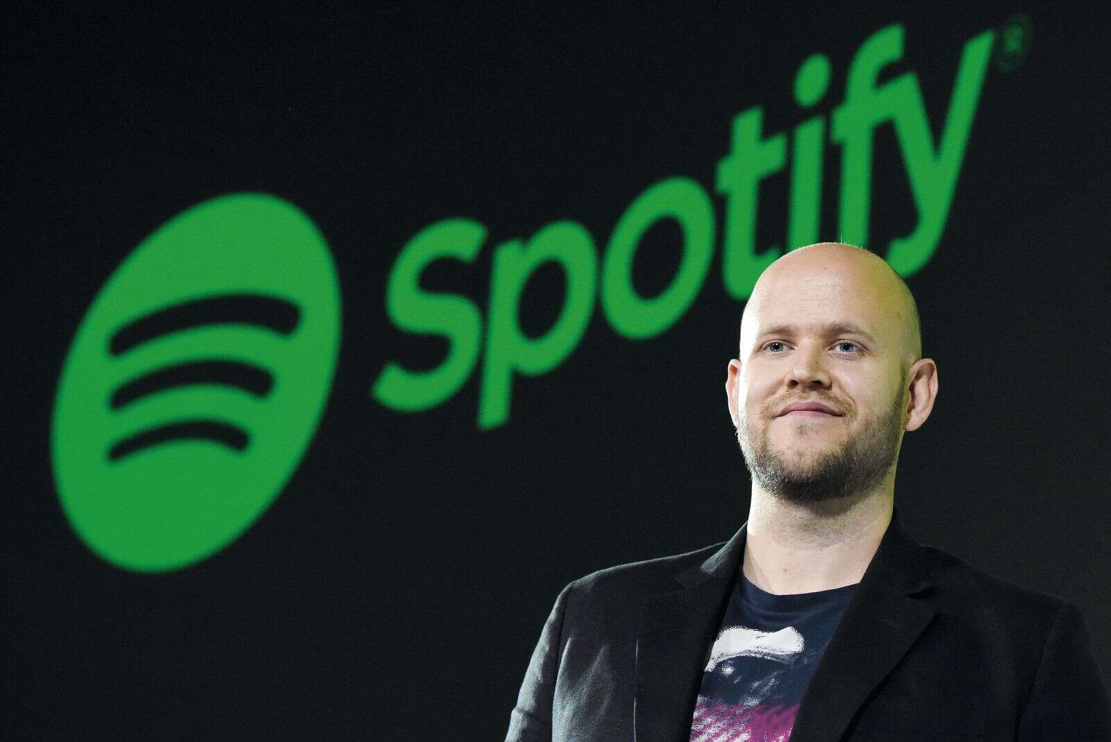 Spotify shares jump 12% as earnings top estimates